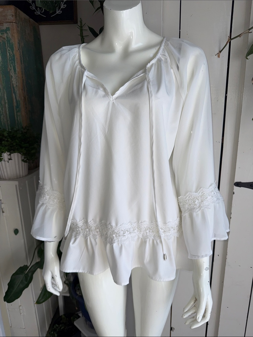 Godshield white long-sleeve top featuring lace trim peplum ruffled hem M EUC